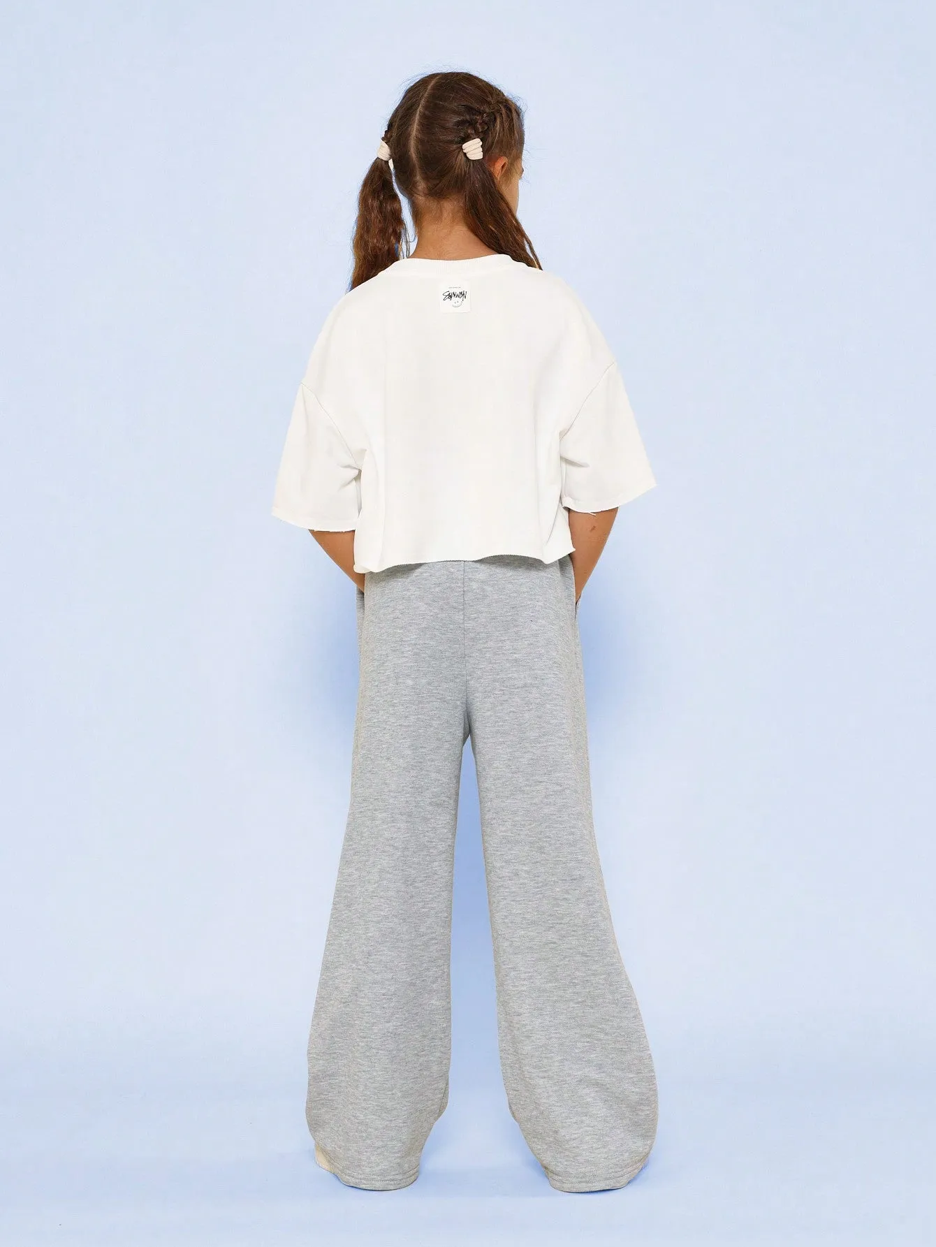 Tween Girls Crop Fit Raw Edge Graphic Print Tee And Pleated Jogger 2 Piece Set
